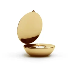Shell votive, brass